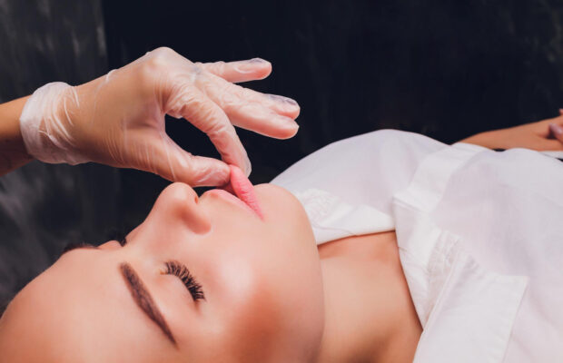 Therapist performing a safe buccal massage at Remedial Studio for facial tension relief