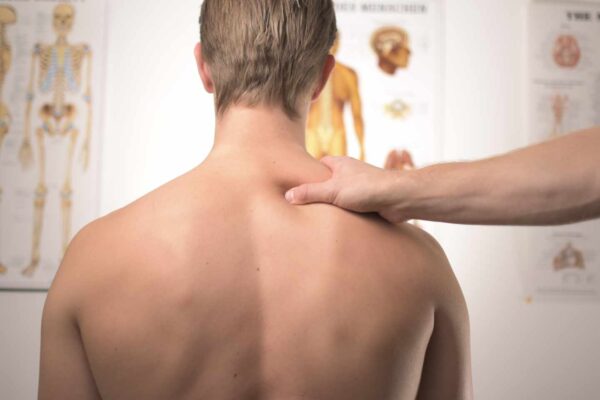 Therapist performing trigger point therapy to relieve muscle tension at Remedial Studio