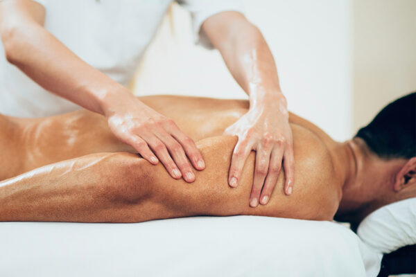 Sports massage therapist providing muscle recovery treatment at Remedial Studio in Marylebone